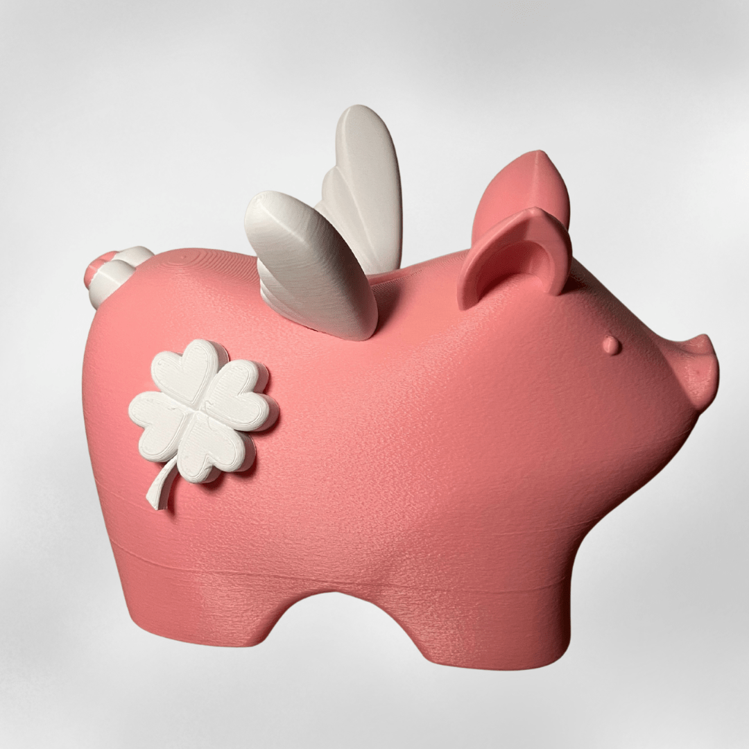 Handgemachte rosa Spardose mit Flügeln und Glücksklee aus 3D-Druck, nachhaltige Geschenkidee von Zauberwerk aus Mittelhessen