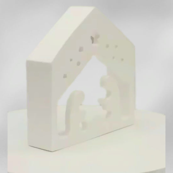 Moderne Weihnachtsdeko Krippe im minimalistischen Stil auf grauem Hintergrund